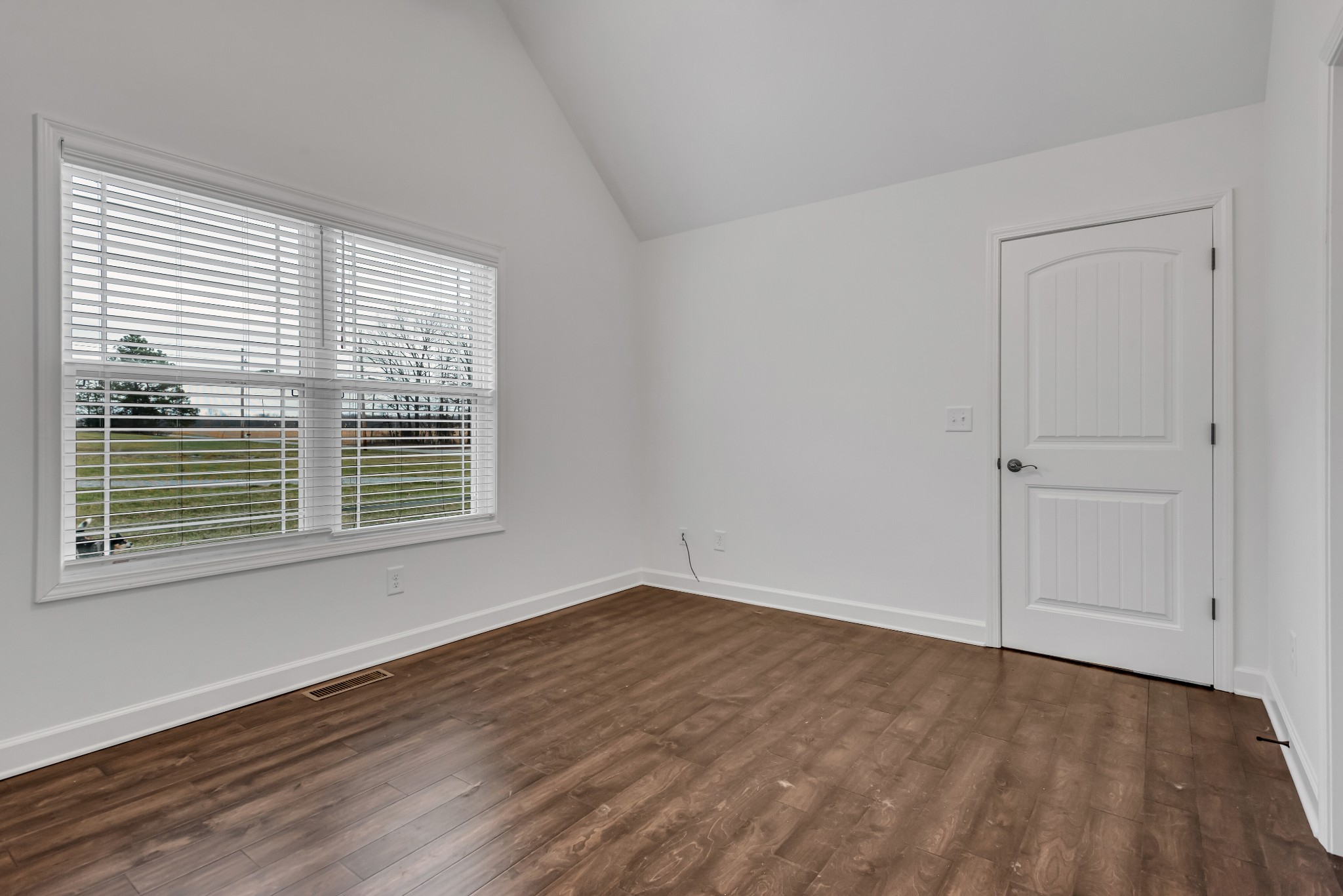 433 Pruett Road Dickson, TN 37055 - Photo 11 of 24 a view of an empty room with wooden floor and a window