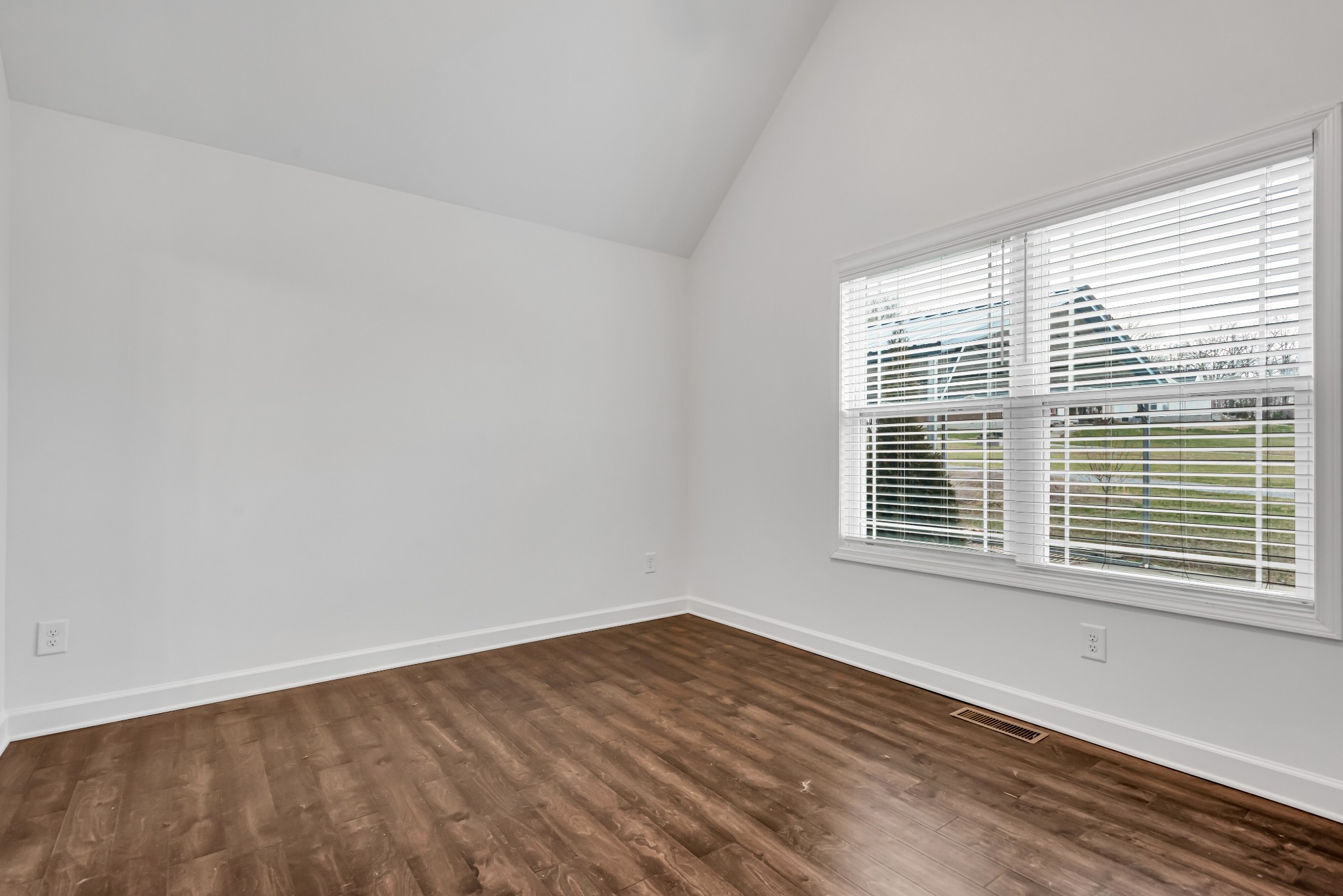 433 Pruett Road Dickson, TN 37055 - Photo 13 of 24 a view of an empty room with wooden floor and a window