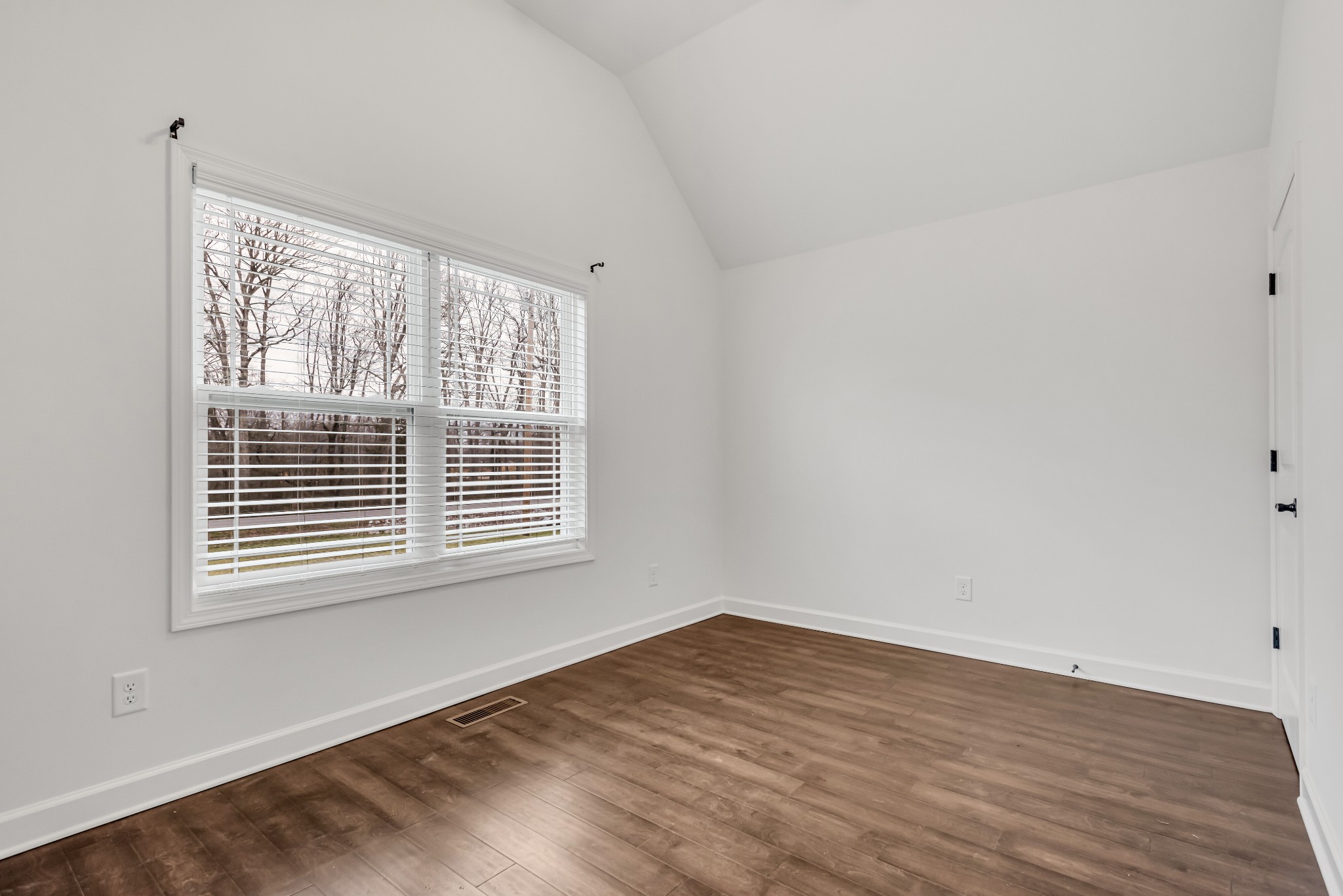 433 Pruett Road Dickson, TN 37055 - Photo 14 of 24 a view of an empty room with wooden floor and a window