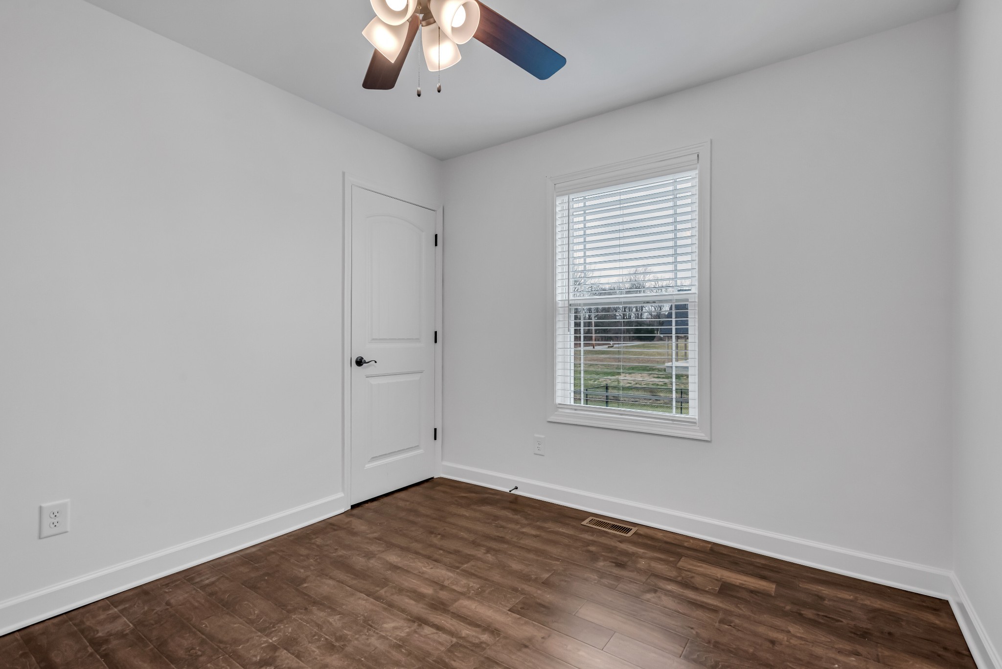 433 Pruett Road Dickson, TN 37055 - Photo 17 of 24 a view of an empty room with wooden floor and a window