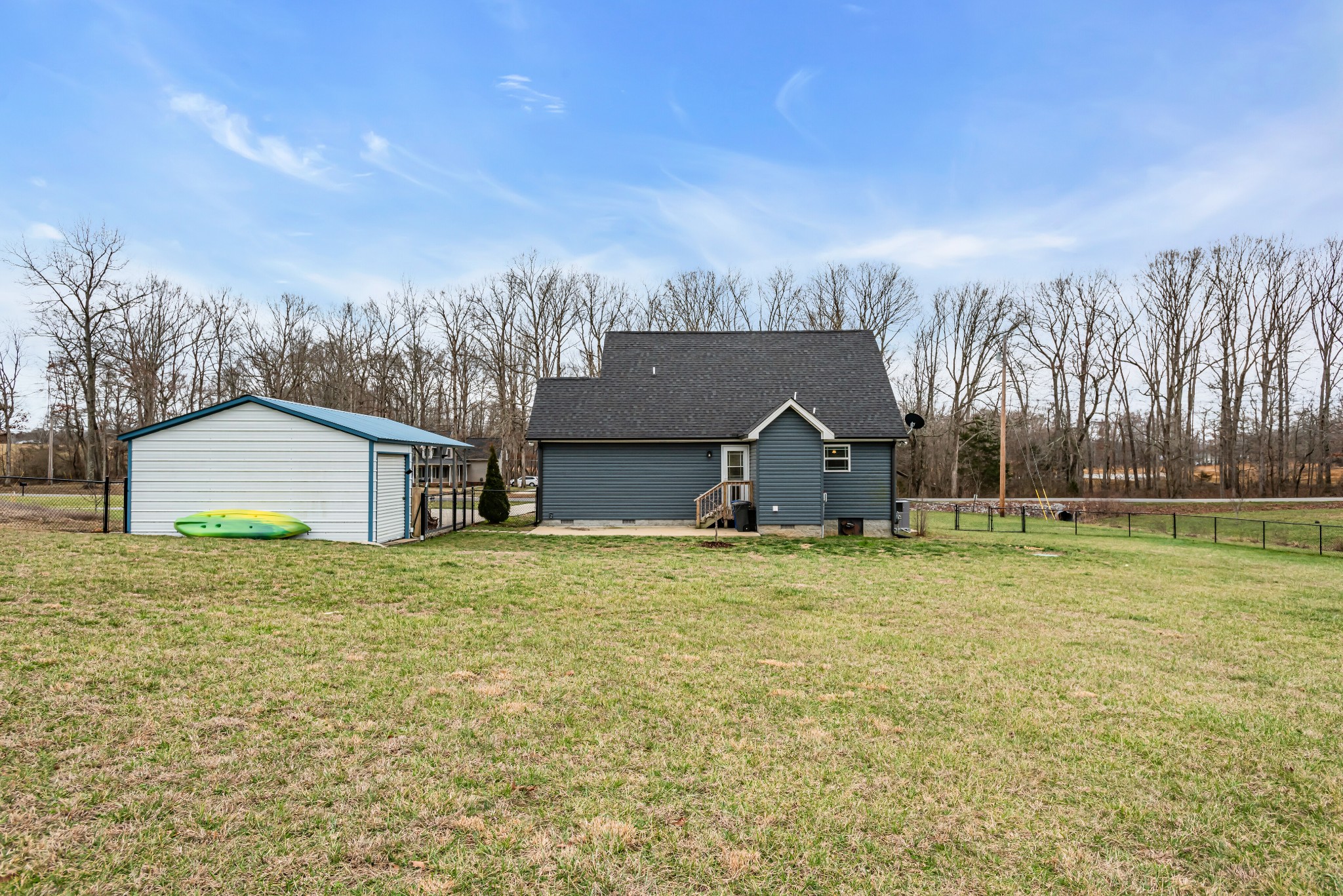 433 Pruett Road Dickson, TN 37055 - Photo 20 of 24 a house with huge green field in front of it
