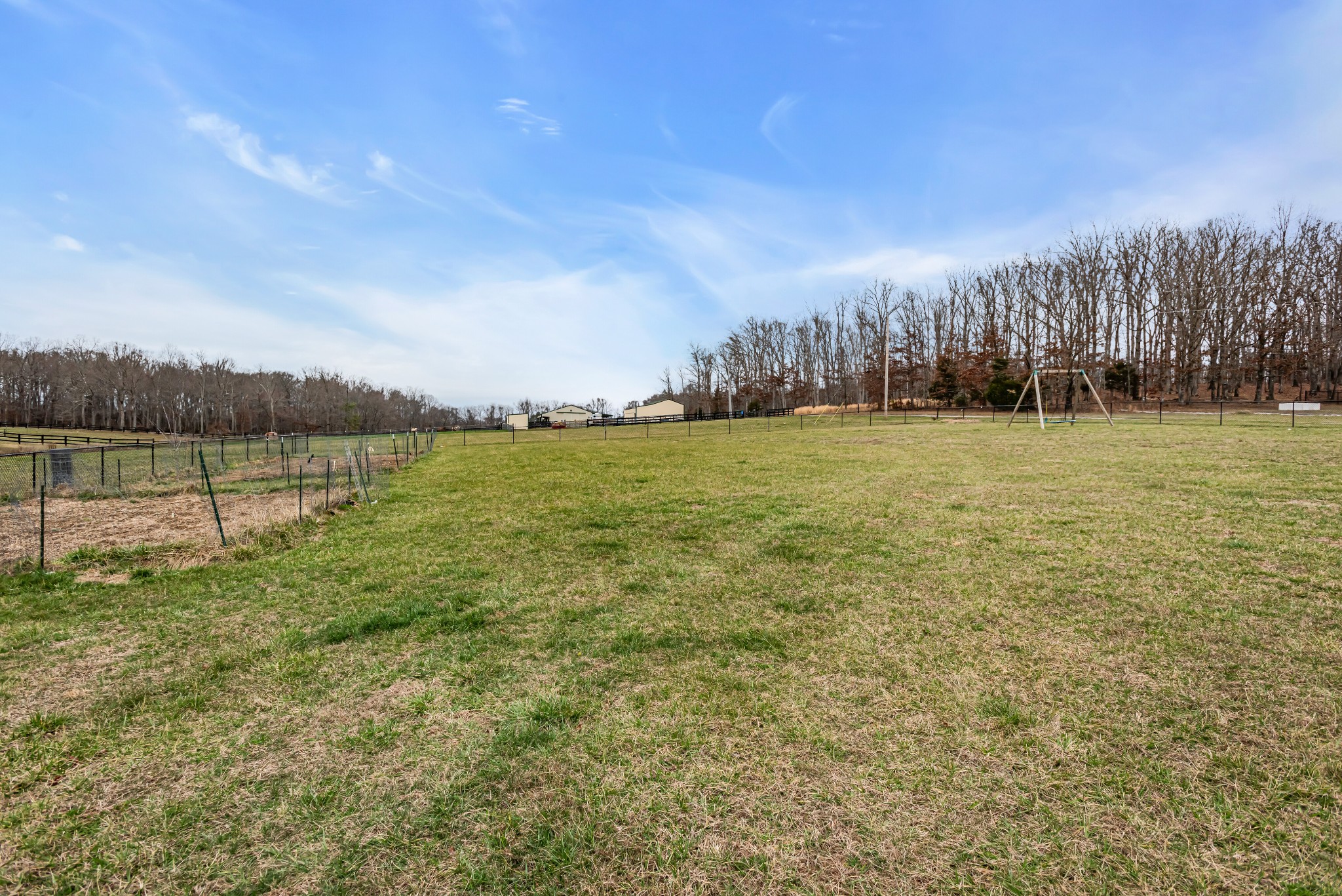 433 Pruett Road Dickson, TN 37055 - Photo 22 of 24 a view of a field with trees in the background