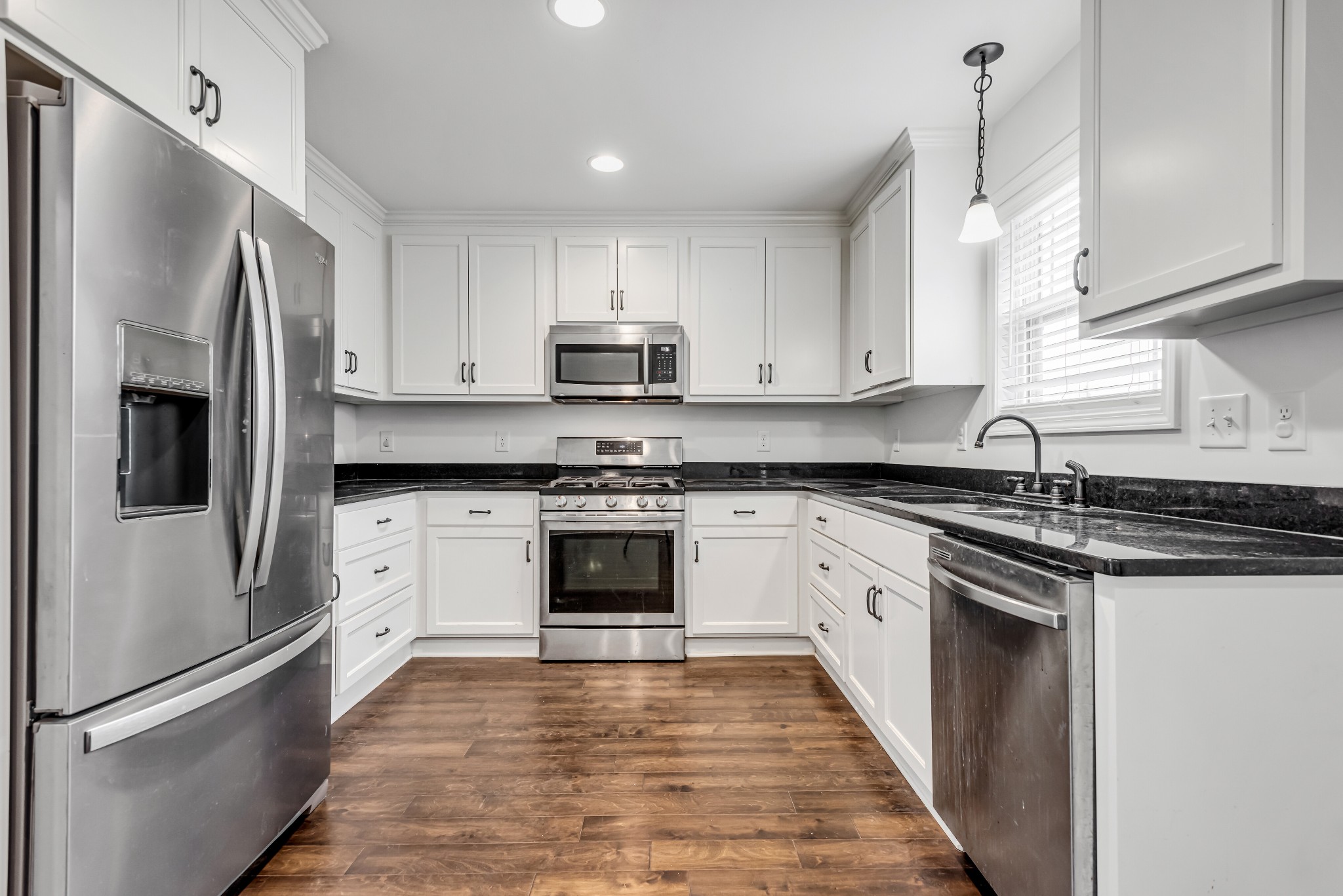 433 Pruett Road Dickson, TN 37055 - Photo 8 of 24 a kitchen with stainless steel appliances granite countertop a refrigerator sink and stove