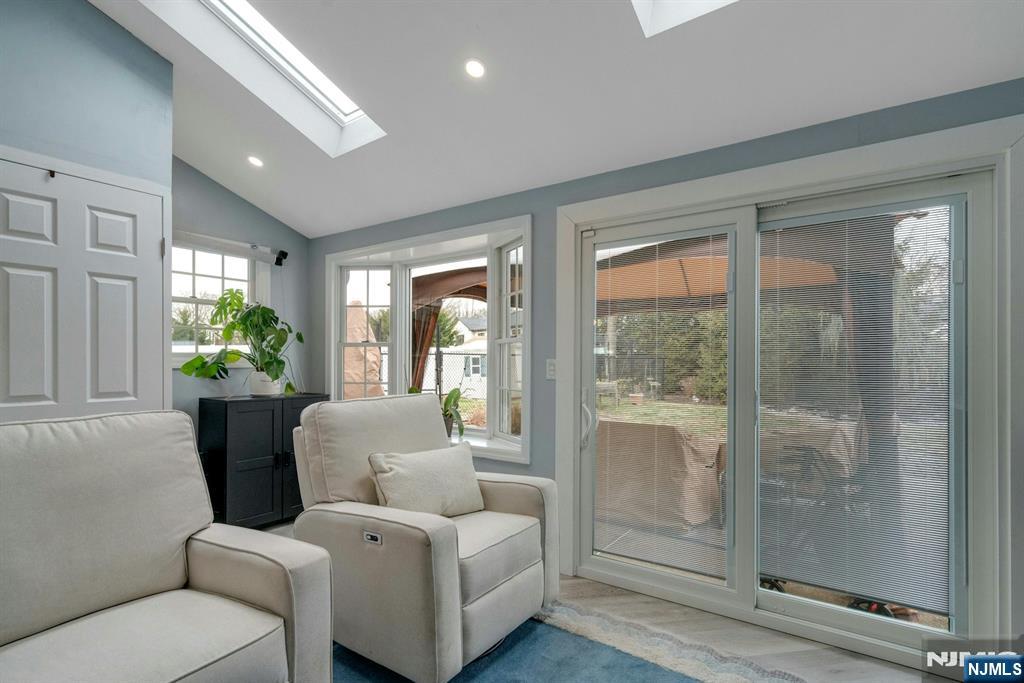 111 Crain Road Paramus, NJ 07652 - Photo 12 of 30 a living room with furniture and a floor to ceiling window