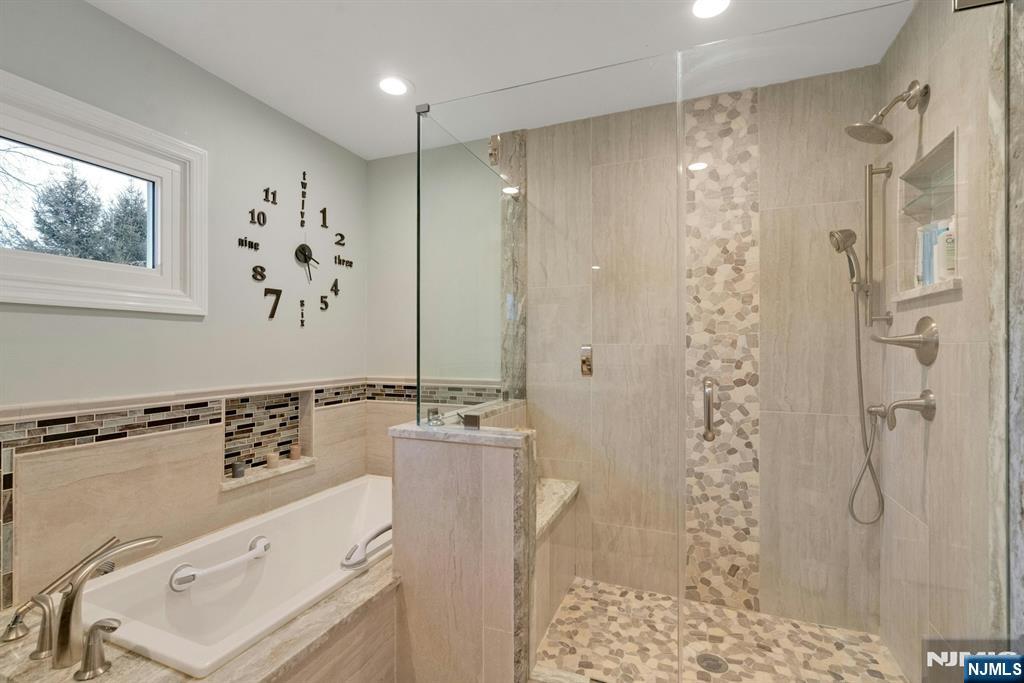 111 Crain Road Paramus, NJ 07652 - Photo 16 of 30 a bathroom with a shower a sink and a mirror