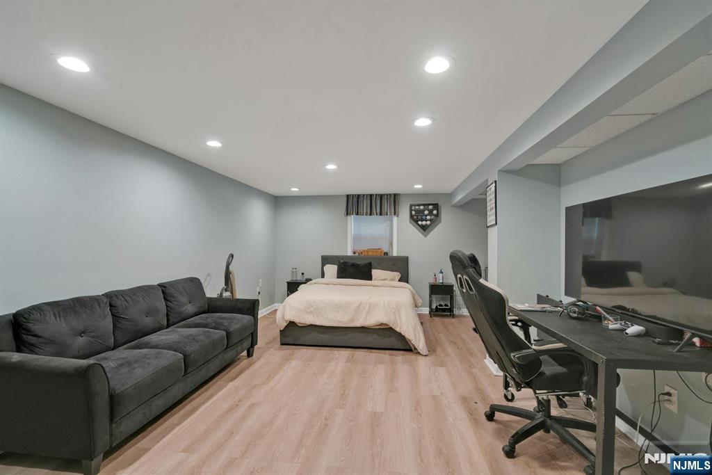 111 Crain Road Paramus, NJ 07652 - Photo 23 of 30 a living room with furniture and a flat screen tv