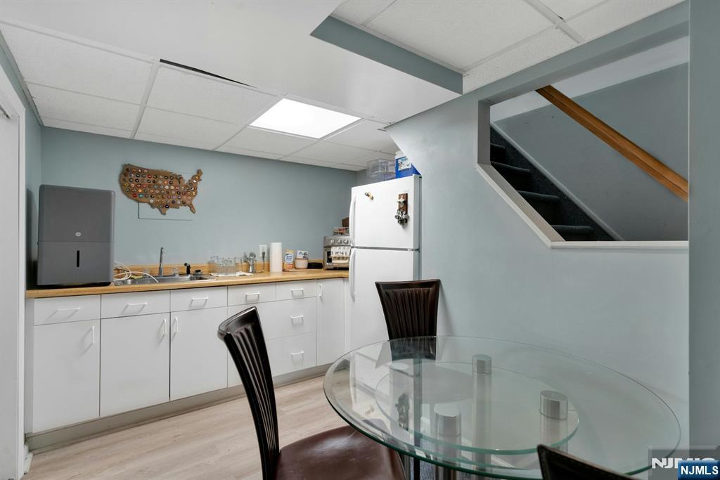 111 Crain Road Paramus, NJ 07652 - Photo 25 of 30 a view of kitchen with cabinets and wooden floor