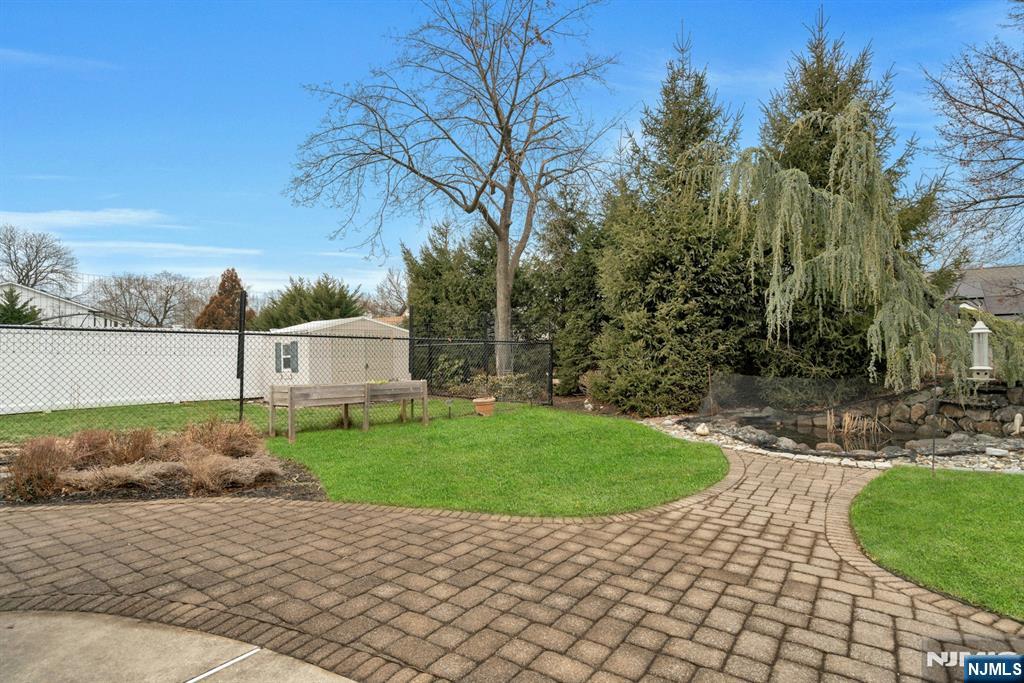 111 Crain Road Paramus, NJ 07652 - Photo 29 of 30 a view of a backyard with large trees