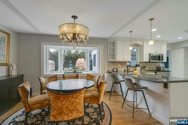 a view of a dining room with furniture window and outside view