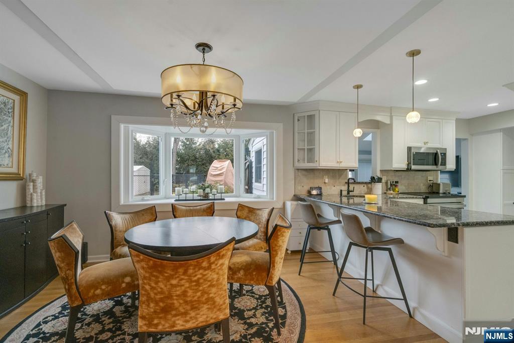 111 Crain Road Paramus, NJ 07652 - Photo 6 of 30 a view of a dining room with furniture window and outside view