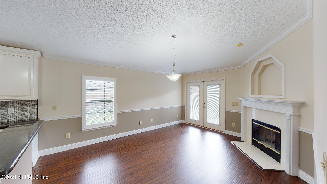 3130 Mountain Ash Road South Jacksonville, FL 32223 - Photo 11 of 60 a view of an empty room with wooden floor and a window