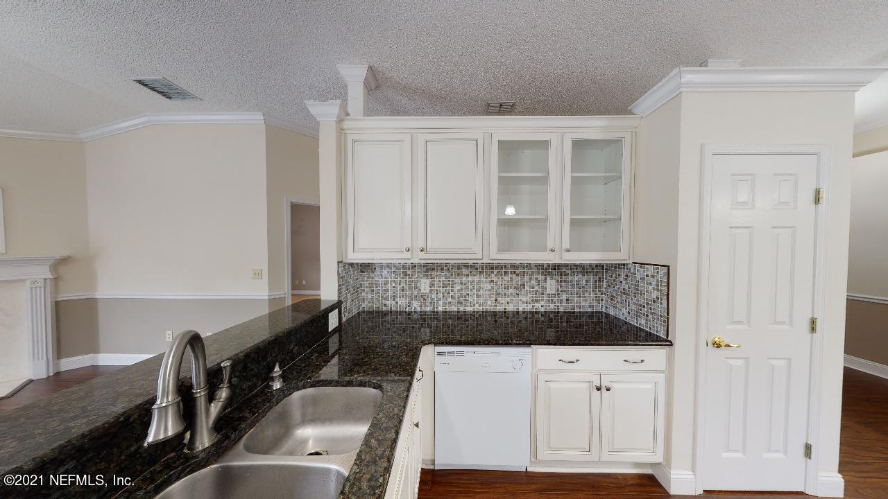 3130 Mountain Ash Road South Jacksonville, FL 32223 - Photo 14 of 60 a kitchen with a sink and a stove top oven