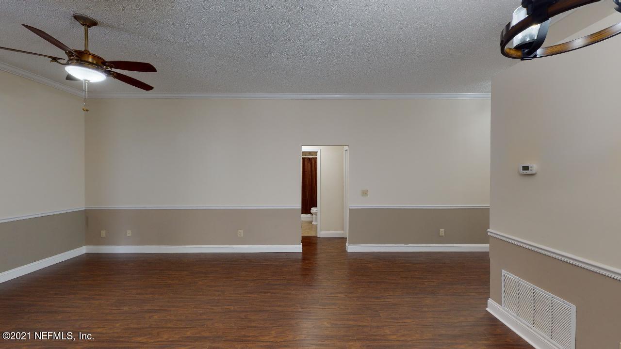 3130 Mountain Ash Road South Jacksonville, FL 32223 - Photo 20 of 60 a view of empty room with wooden floor and fan