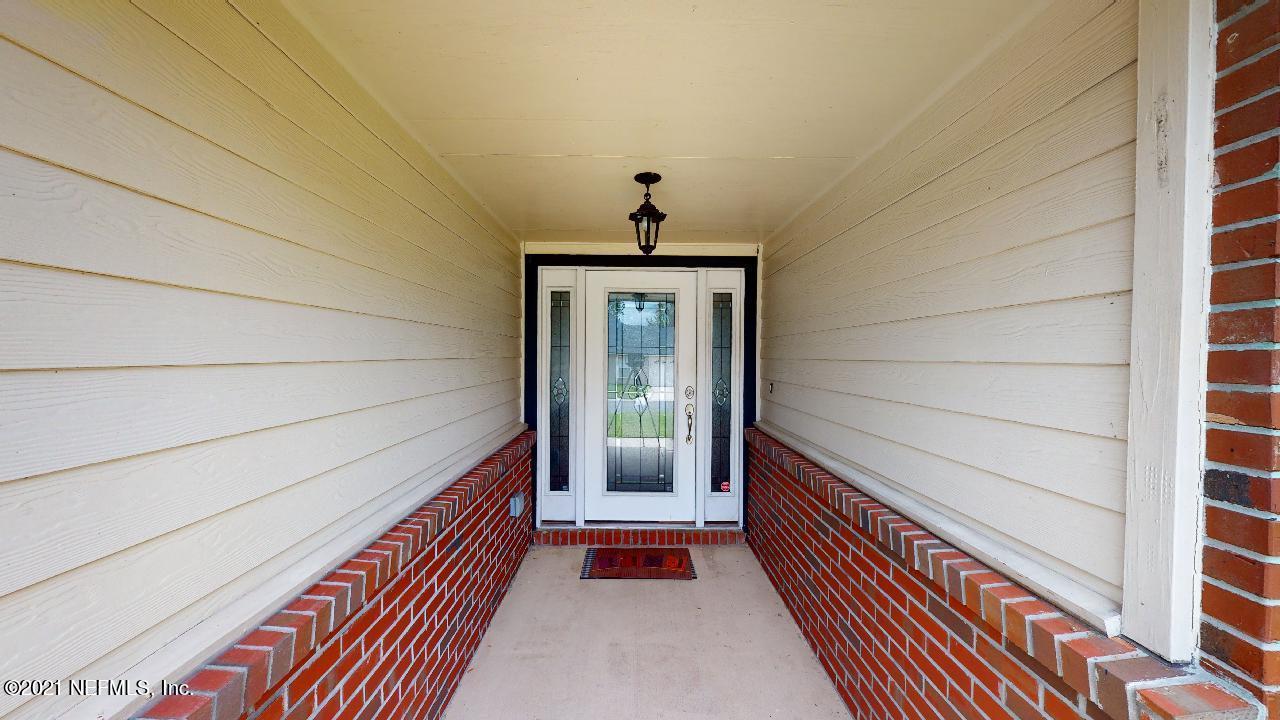 3130 Mountain Ash Road South Jacksonville, FL 32223 - Photo 3 of 60 a view of a room that has wooden floor and a window
