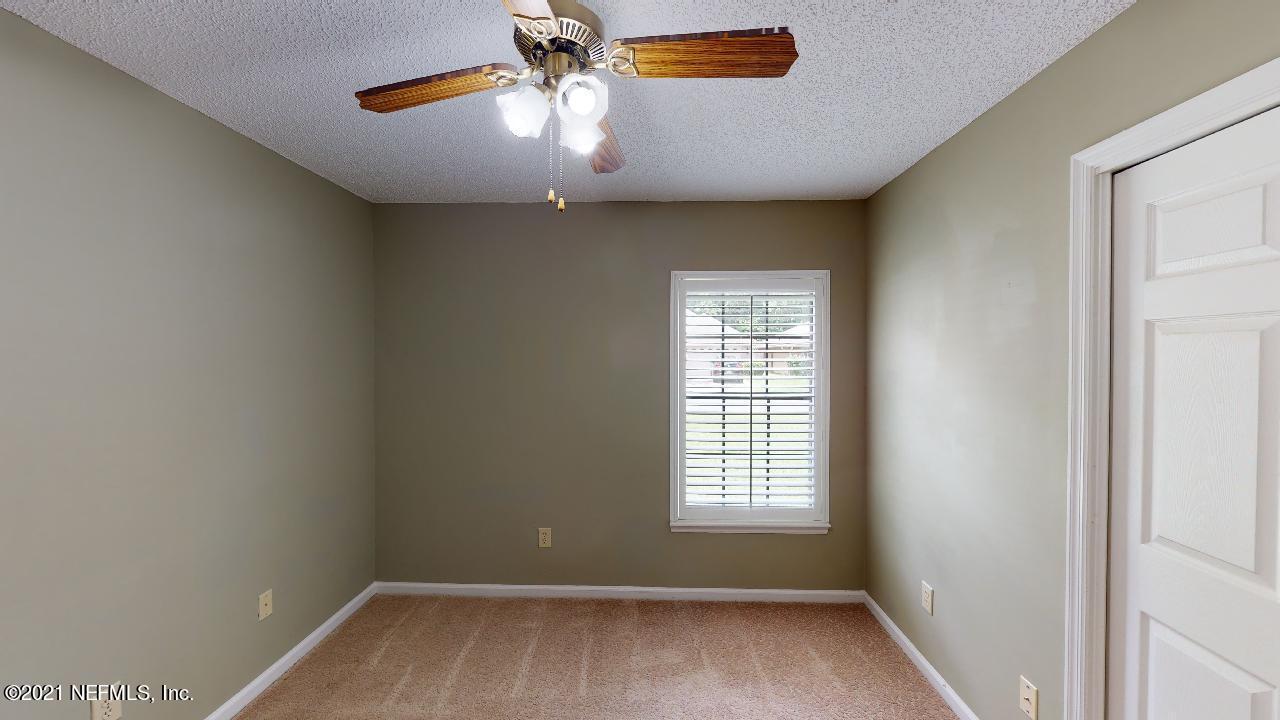 3130 Mountain Ash Road South Jacksonville, FL 32223 - Photo 34 of 60 a view of room with a ceiling fan and window