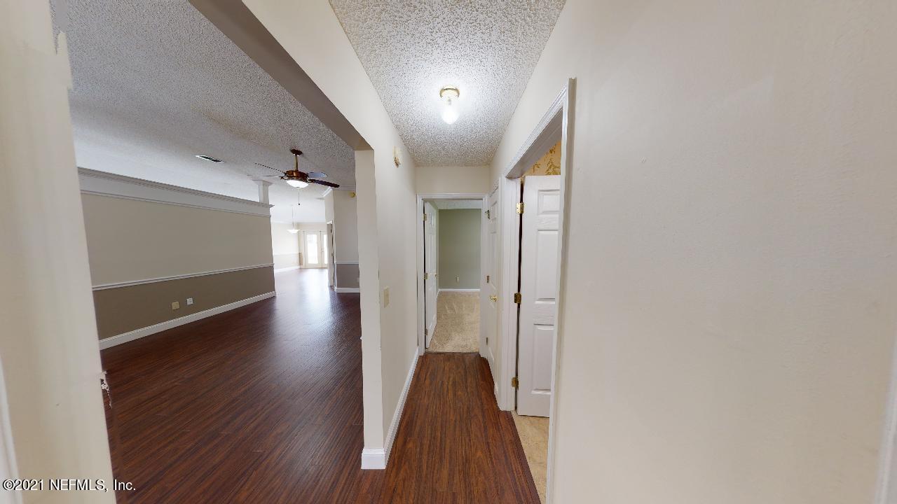 3130 Mountain Ash Road South Jacksonville, FL 32223 - Photo 36 of 60 a view of a hallway with wooden floor and staircase