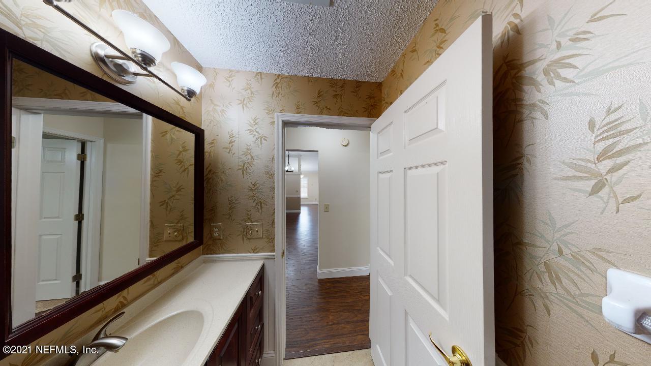 3130 Mountain Ash Road South Jacksonville, FL 32223 - Photo 39 of 60 a view of a hallway with wooden floor and staircase