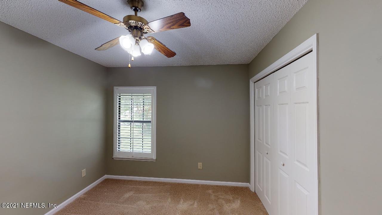 3130 Mountain Ash Road South Jacksonville, FL 32223 - Photo 41 of 60 wooden floor in an empty room with a window