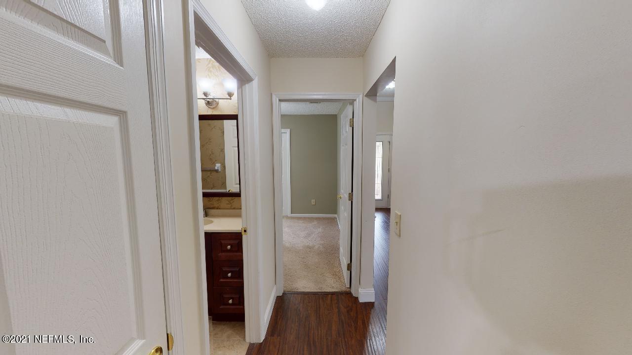 3130 Mountain Ash Road South Jacksonville, FL 32223 - Photo 44 of 60 a view of a hallway with wooden floor and closet