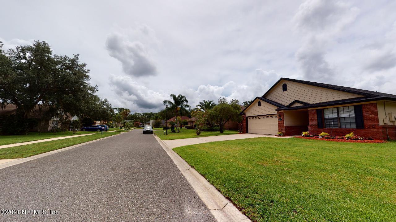 3130 Mountain Ash Road South Jacksonville, FL 32223 - Photo 55 of 60 a view of a house with a big yard and a large trees