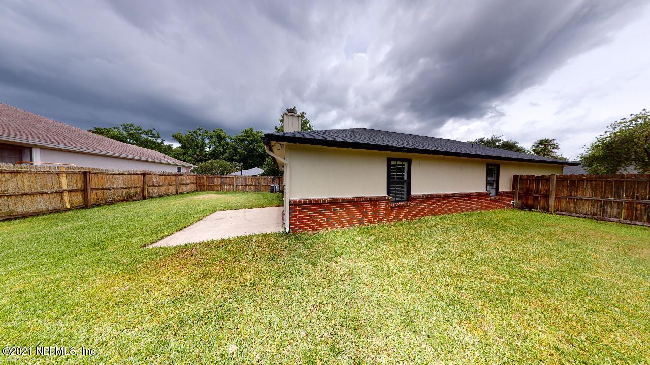 3130 Mountain Ash Road South Jacksonville, FL 32223 - Photo 57 of 60 a front view of a house with garden