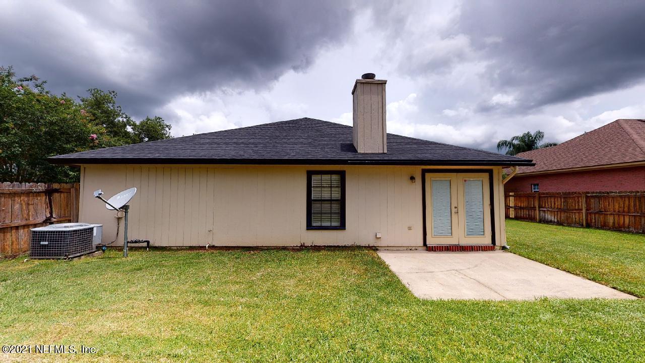 3130 Mountain Ash Road South Jacksonville, FL 32223 - Photo 60 of 60 a front view of a house with garden