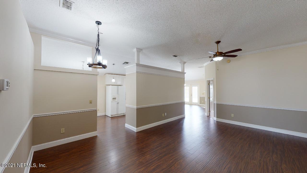 3130 Mountain Ash Road South Jacksonville, FL 32223 - Photo 6 of 60 an empty room with wooden floor sink and mirror