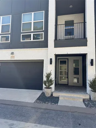 a view of a house with a potted plant and a window