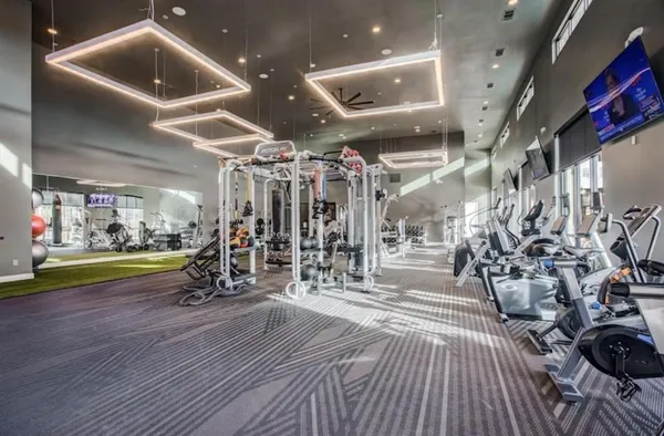a view of an chairs room with furniture and a chandelier