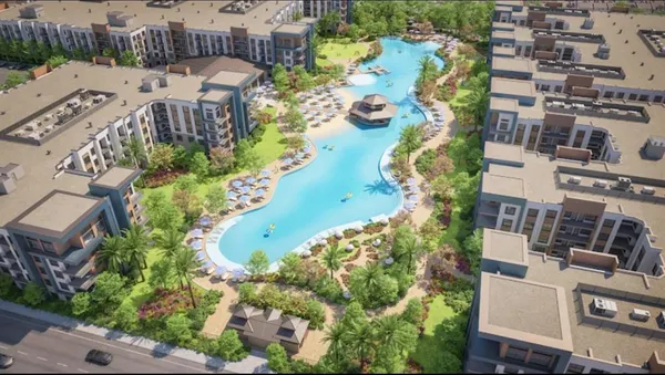 a living room with furniture pool table and a large window