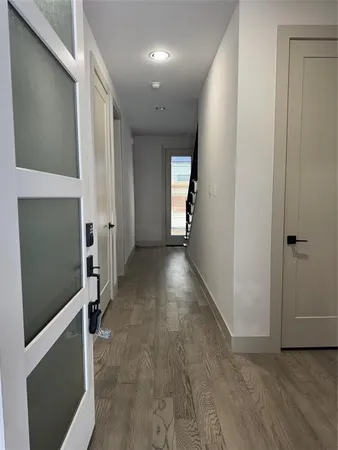 wooden floor in a hall with an entryway