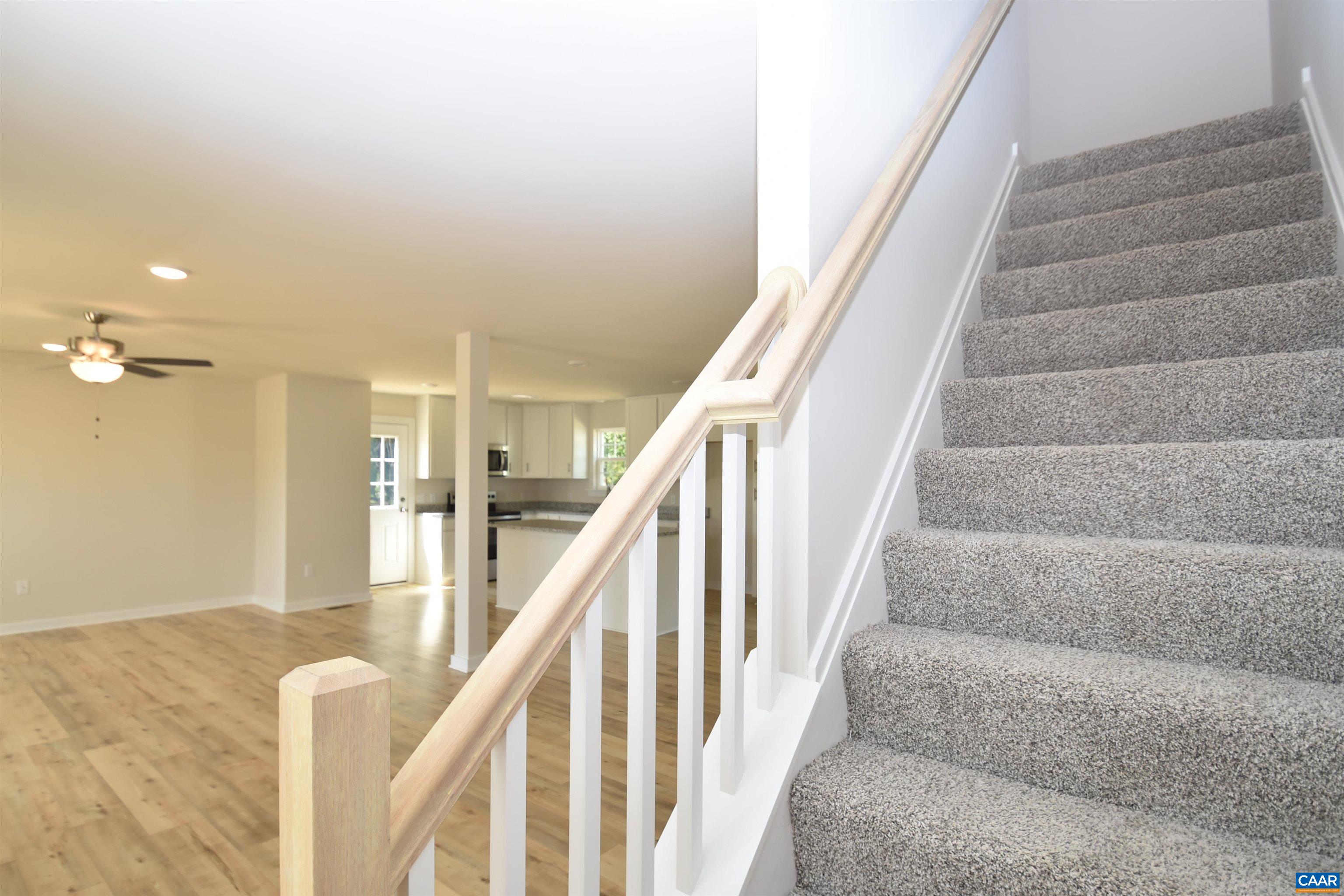 4635 James Madison Highway Fork Union, VA 23055 - Photo 14 of 22 a view of staircase with lots of frames on wall