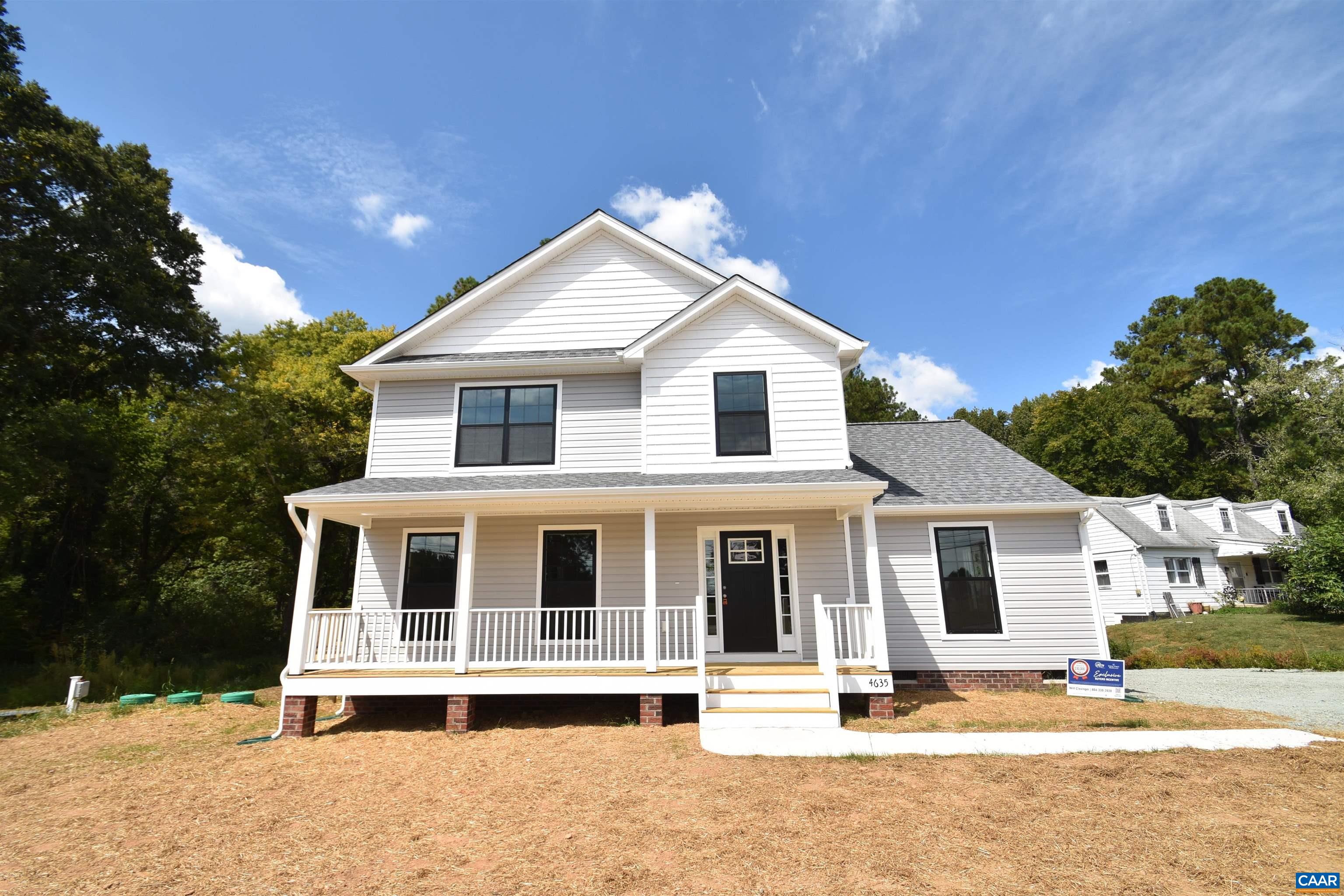 4635 James Madison Highway Fork Union, VA 23055 - Photo 3 of 22 a view of a white house with large windows and a table and chairs