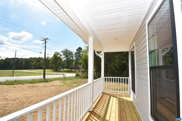 a view of balcony with a yard