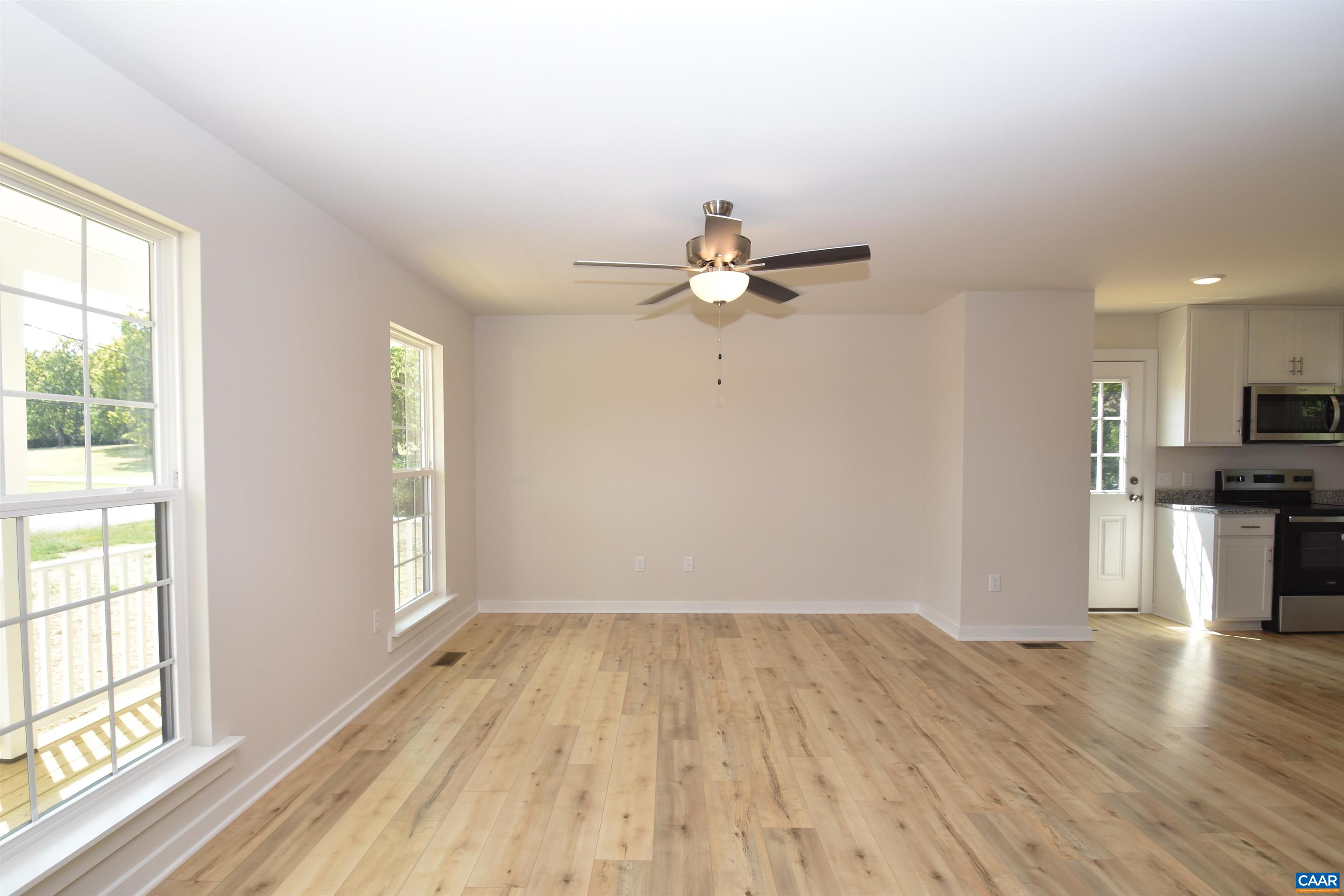4635 James Madison Highway Fork Union, VA 23055 - Photo 6 of 22 wooden floor in an empty room with a window