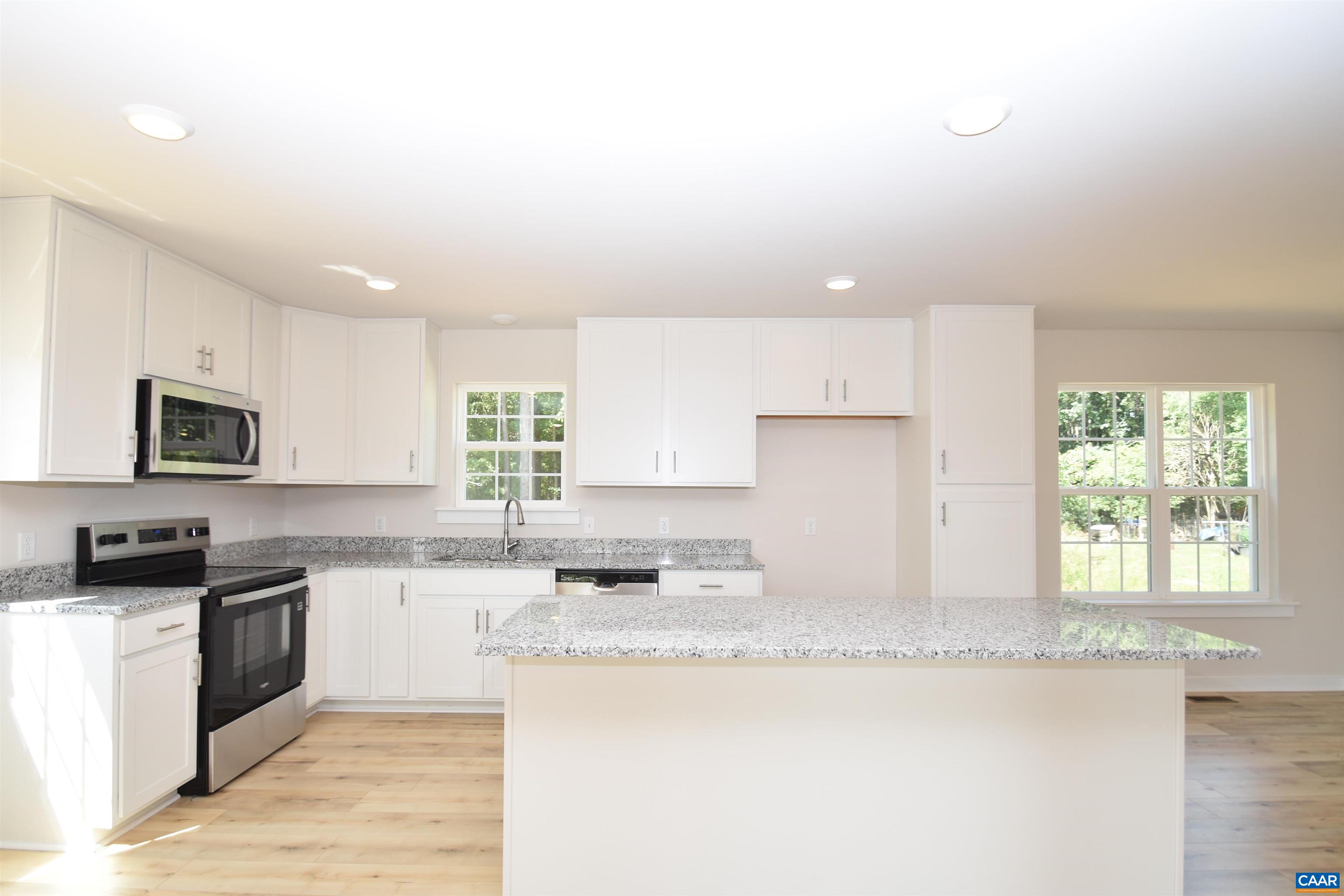 4635 James Madison Highway Fork Union, VA 23055 - Photo 7 of 22 a kitchen with granite countertop a sink cabinets and window