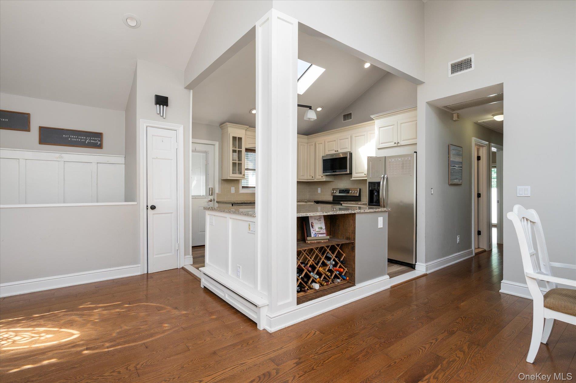 126 Walnut Road Kings Park, NY 11754 - Photo 11 of 33 a kitchen with stainless steel appliances kitchen island granite countertop a refrigerator and a stove top oven