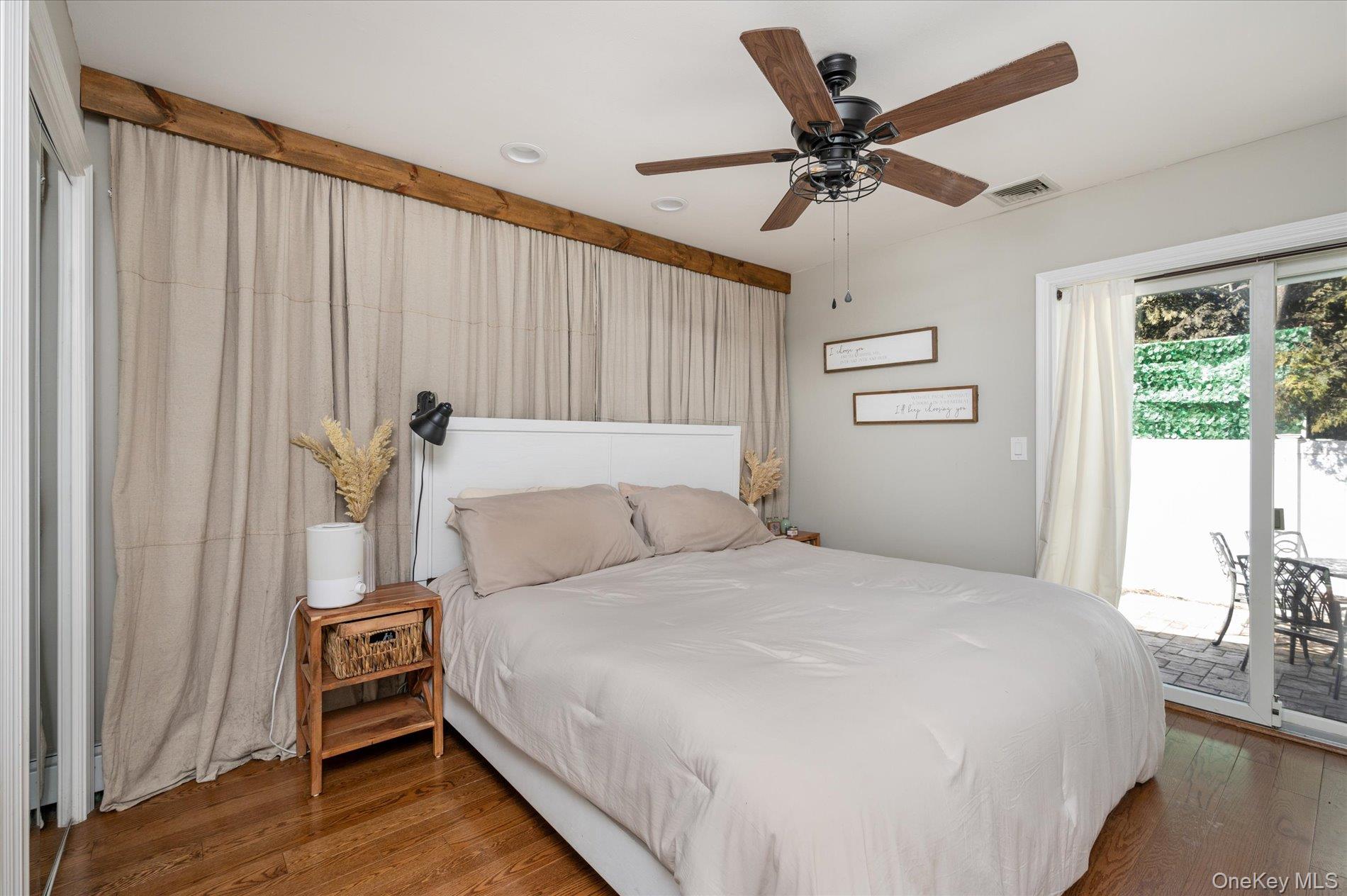 126 Walnut Road Kings Park, NY 11754 - Photo 12 of 33 a bedroom with a bed and a window