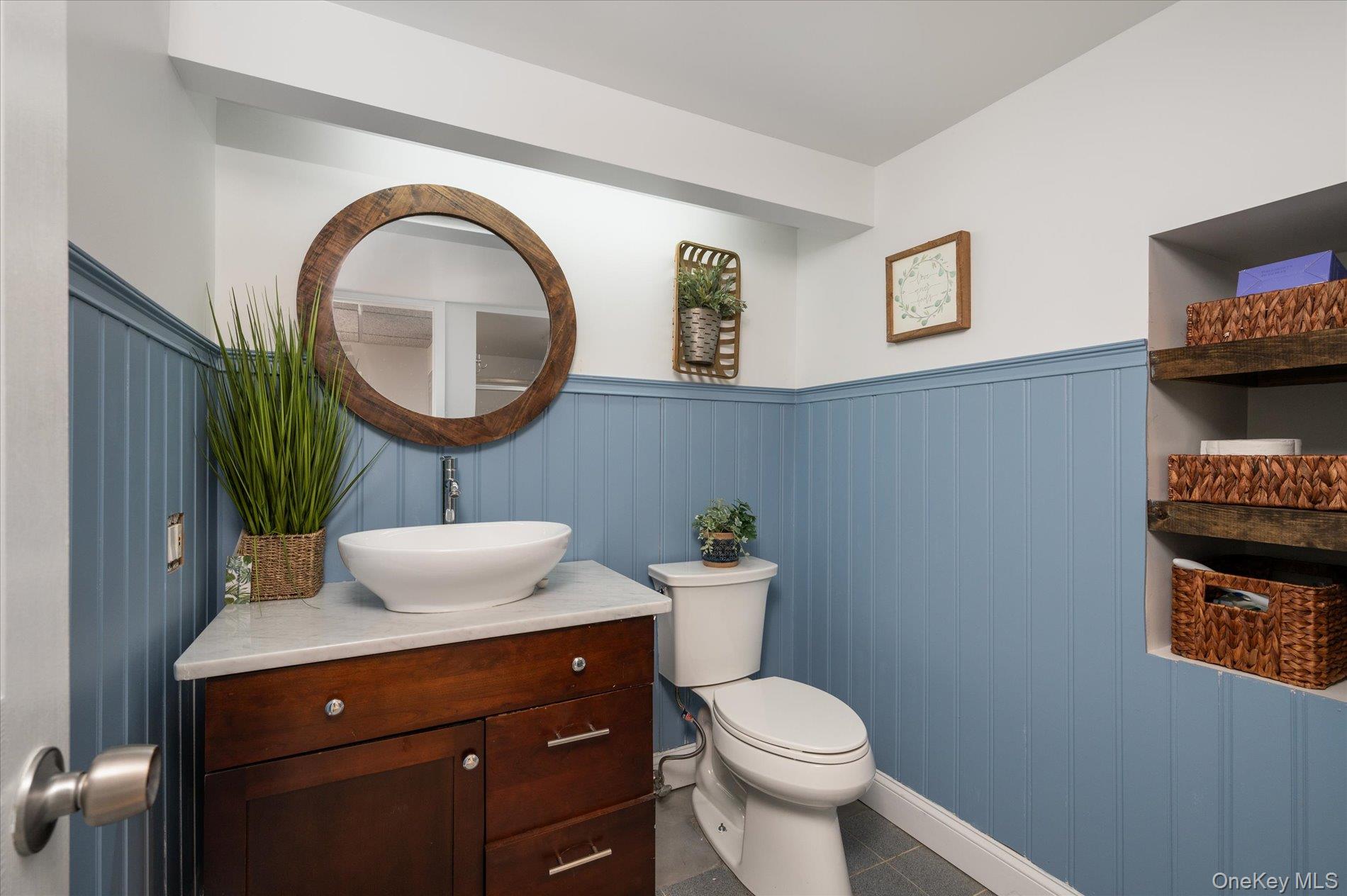 126 Walnut Road Kings Park, NY 11754 - Photo 21 of 33 a bathroom with a toilet a sink and mirror