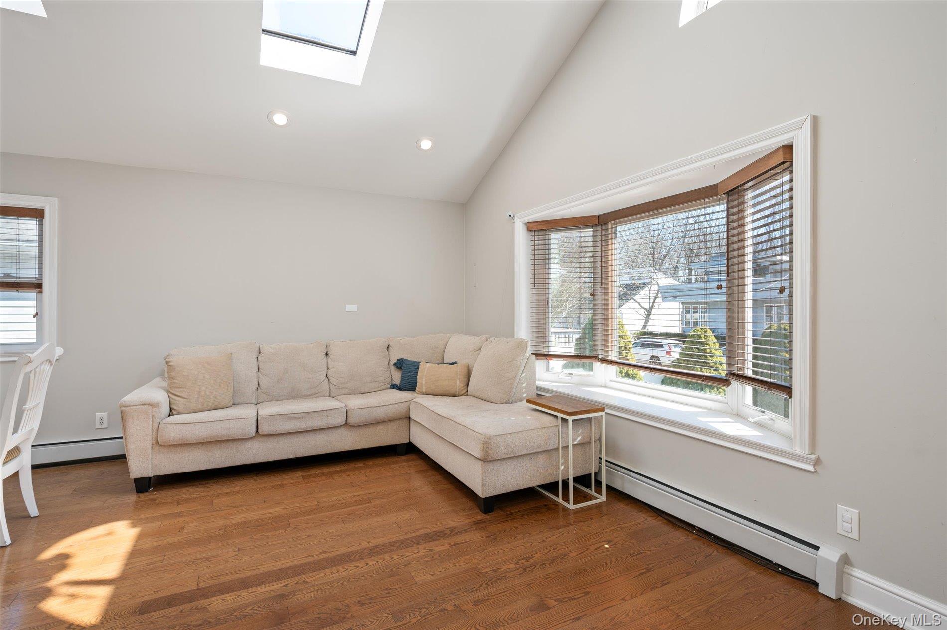 126 Walnut Road Kings Park, NY 11754 - Photo 5 of 33 a living room with furniture and a large window