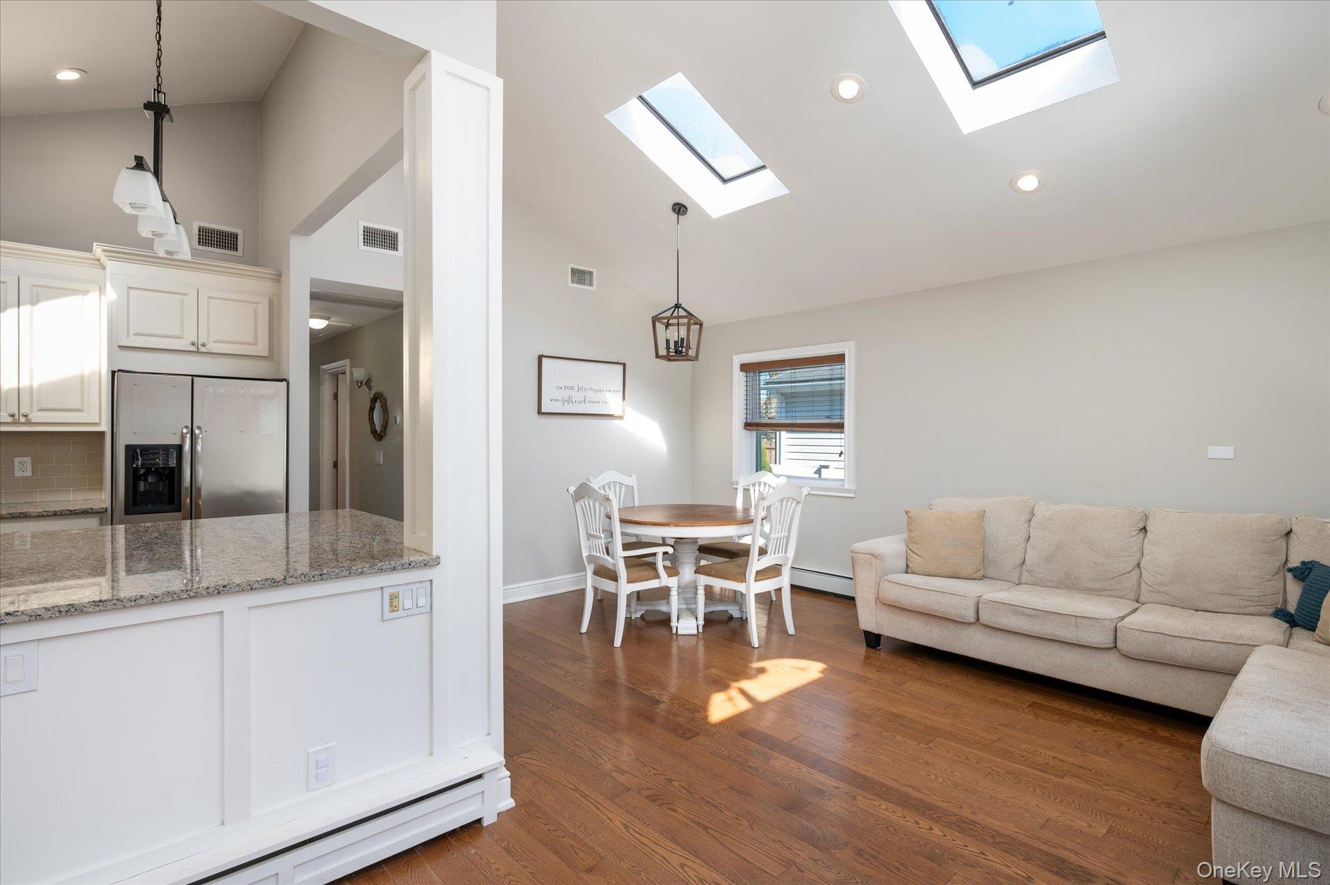 126 Walnut Road Kings Park, NY 11754 - Photo 7 of 33 a living room with furniture and wooden floor