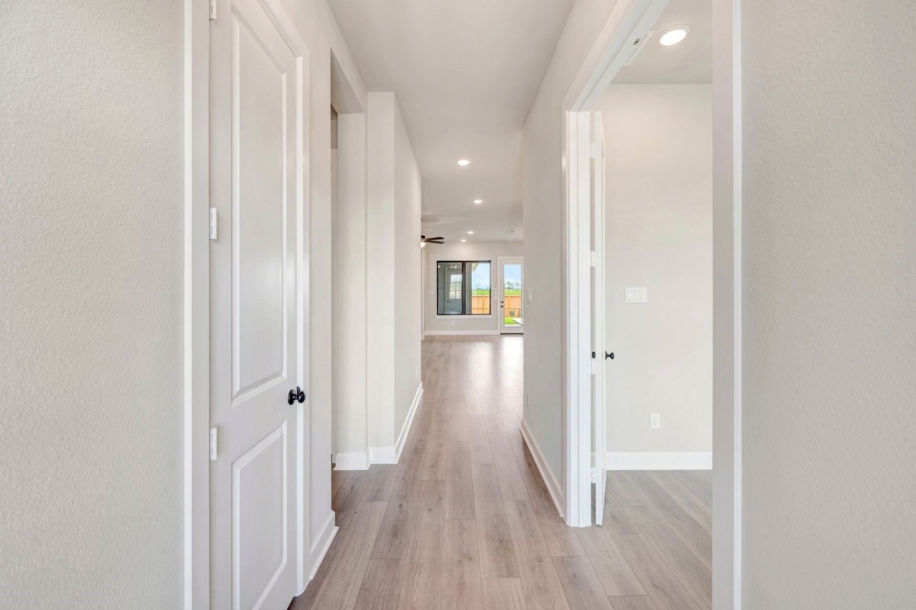 2722 Cottage Place Rosharon, TX 77583 - Photo 12 of 50 a view of a hallway with wooden floor