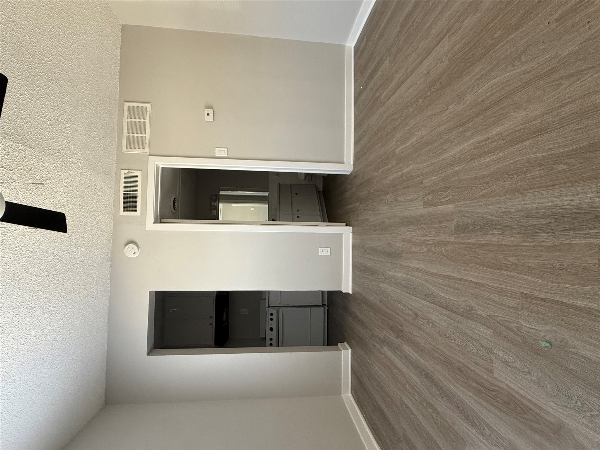 311 East 31st Street, Unit 203B Austin, TX 78705 - Photo 6 of 8 an empty room with wooden floor and closet