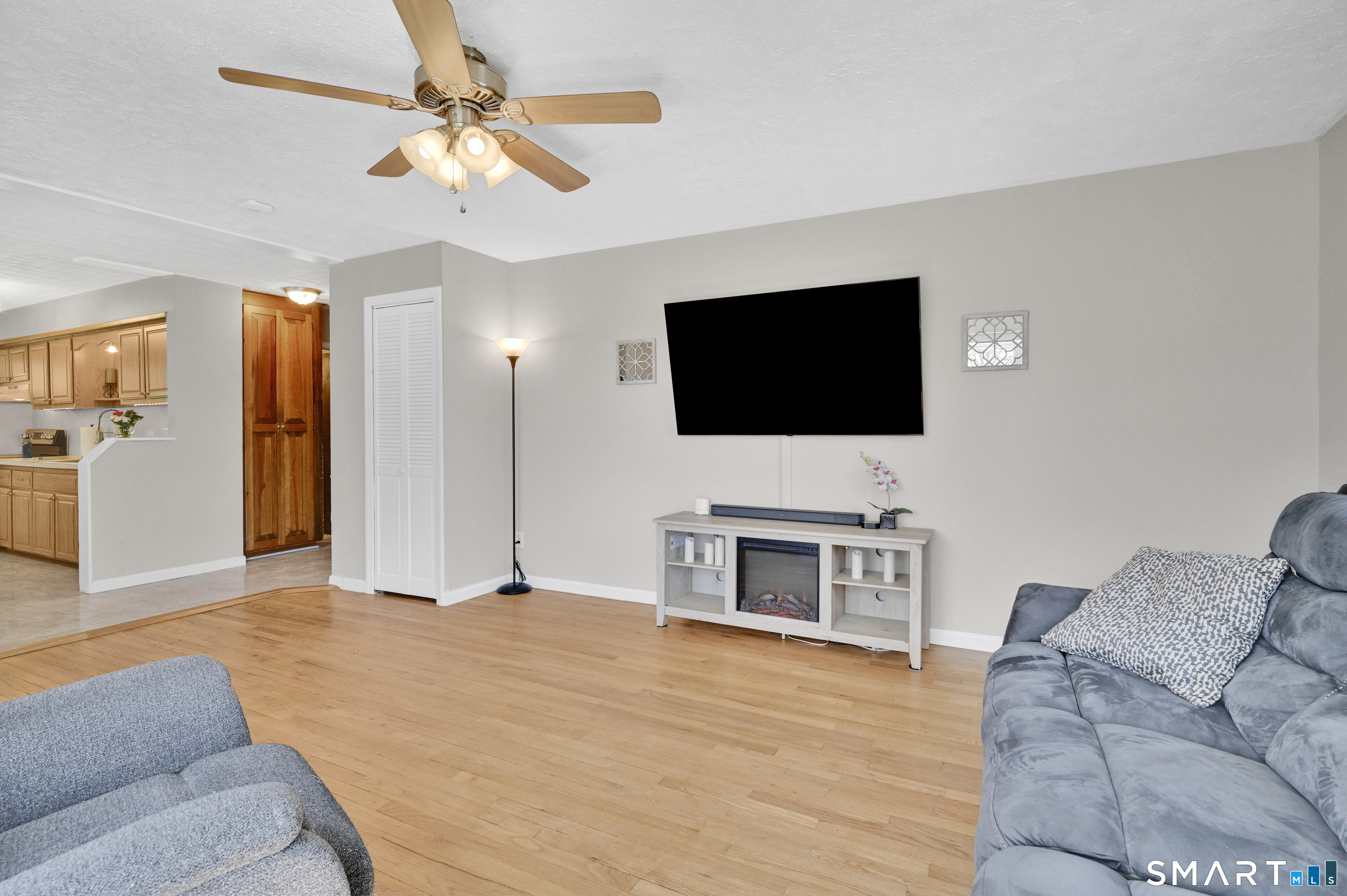 15 Meade Lane Enfield, CT 06082 - Photo 12 of 31 a living room with furniture and a flat screen tv