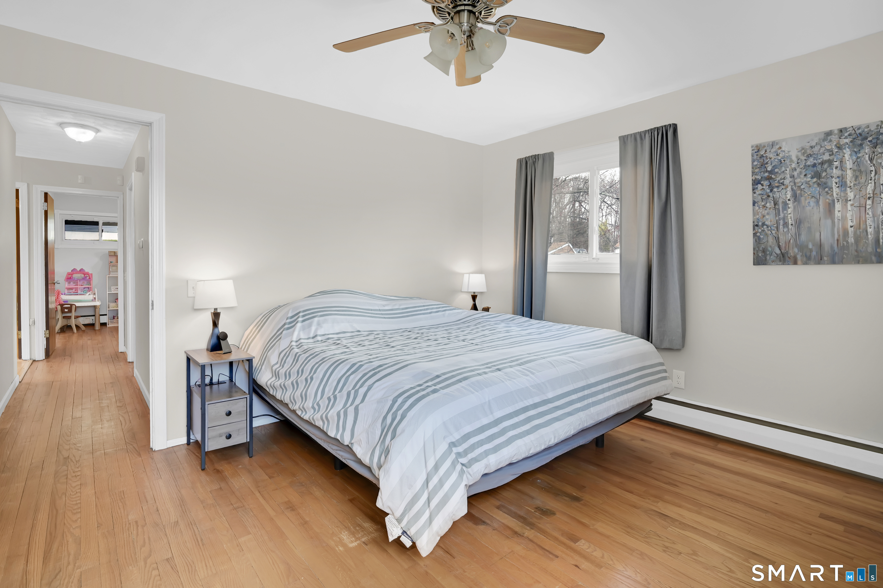 15 Meade Lane Enfield, CT 06082 - Photo 16 of 31 a bedroom with a bed and a chandelier