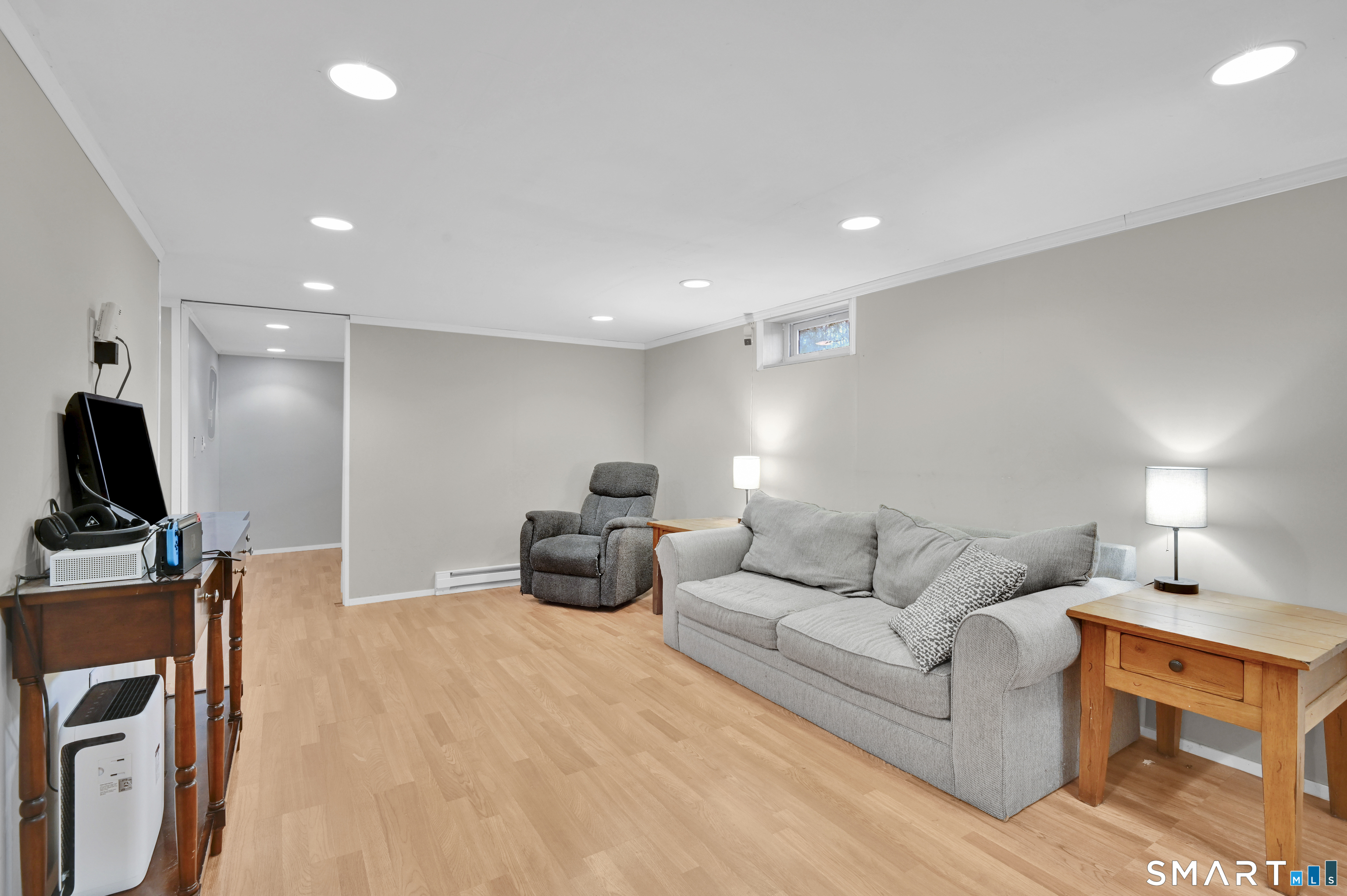 15 Meade Lane Enfield, CT 06082 - Photo 22 of 31 a living room with furniture and a flat screen tv
