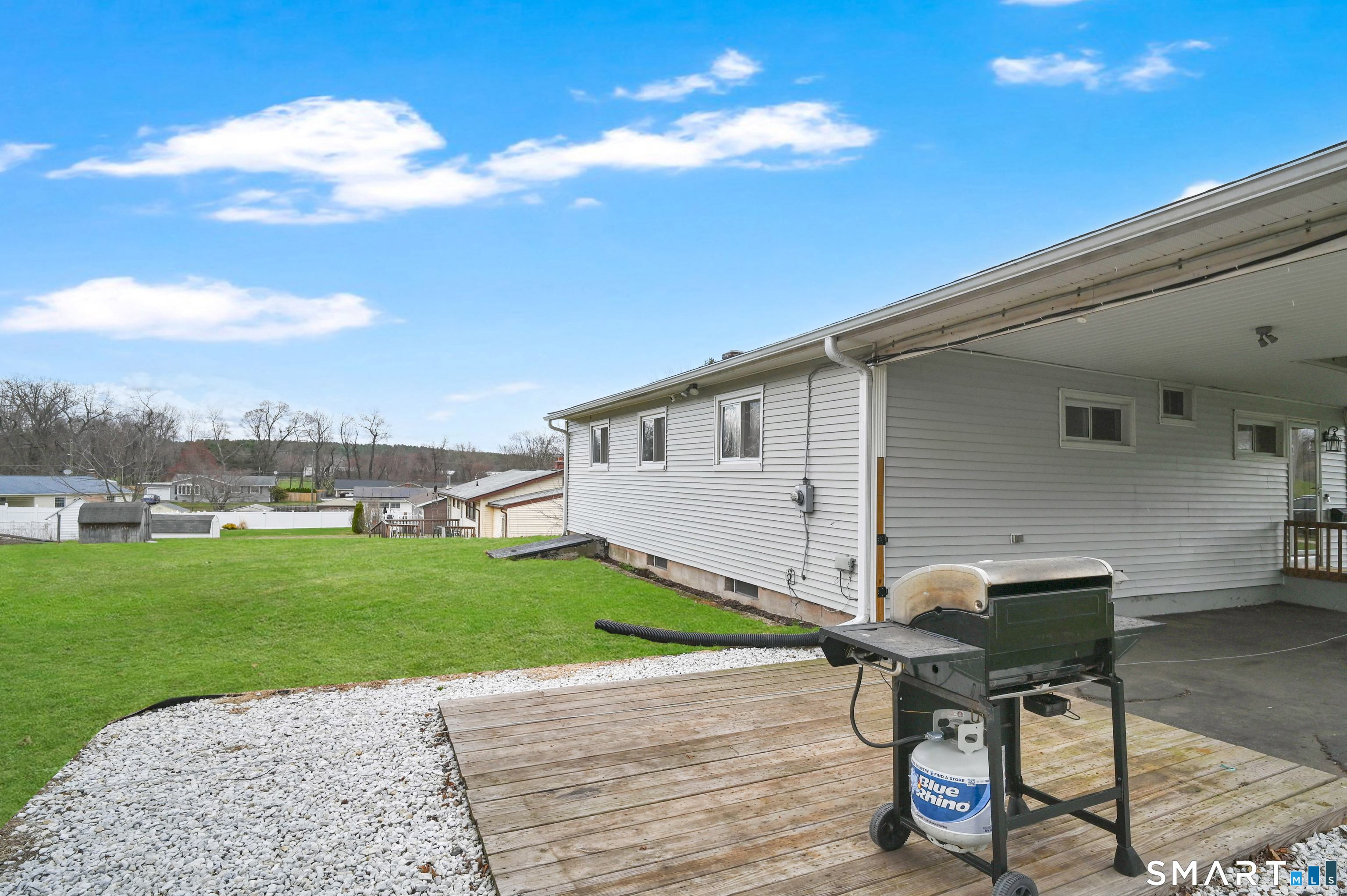 15 Meade Lane Enfield, CT 06082 - Photo 29 of 31 a view of a backyard with a sitting area