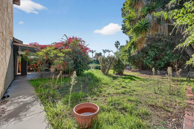 a backyard of a house with lots of green space