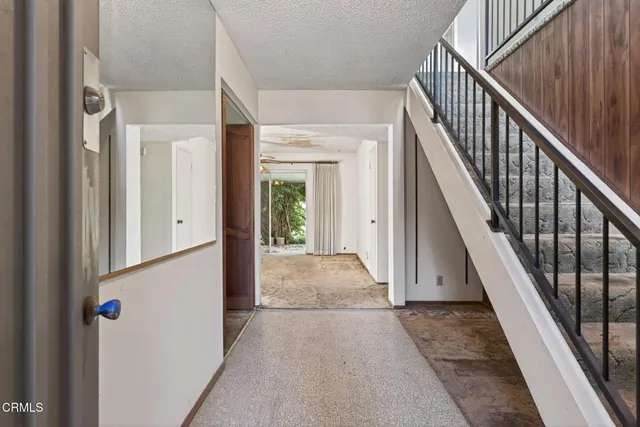 a view of staircase with wooden floor and stairs