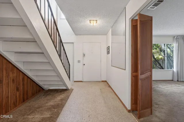 a view of hallway with stairs